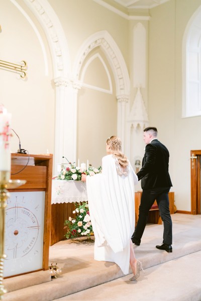 bride and groom at the alter from behind