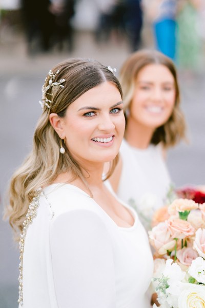 bride looks to camera all smiles