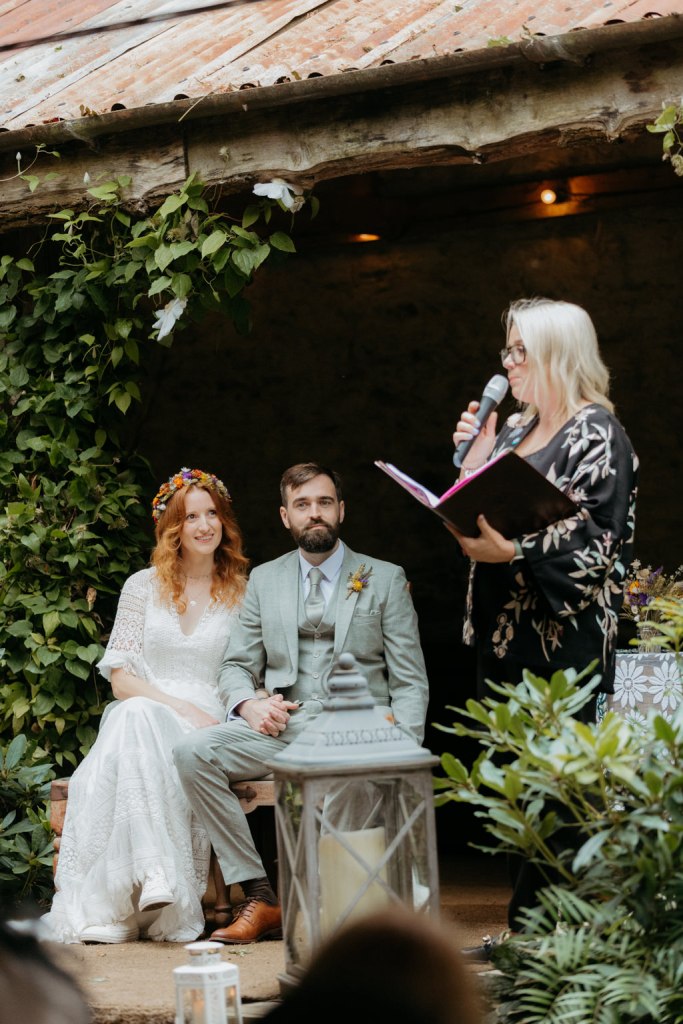 bride groom and celebrant at alter setting