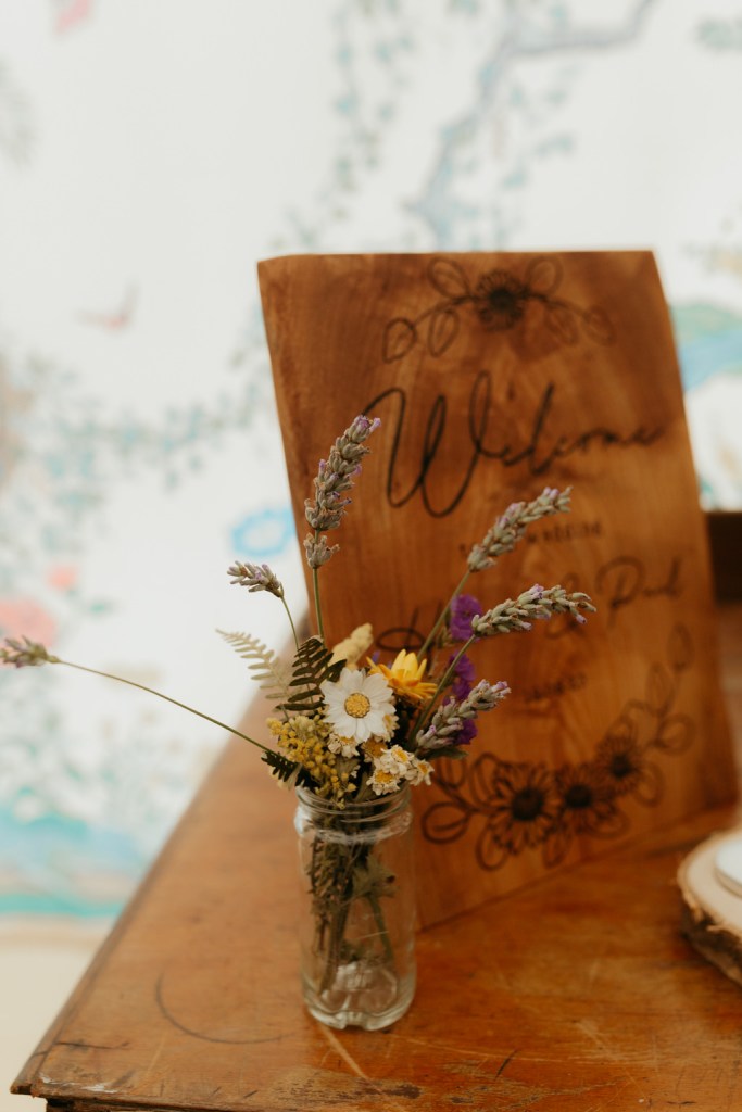 flowers in a vase welcome to the wedding of