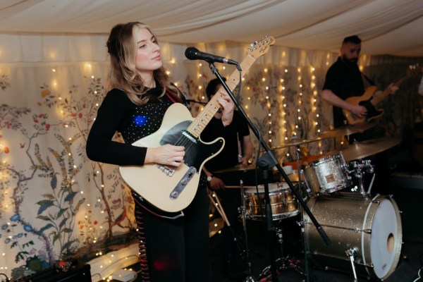 wedding band singer playing guitar singing music