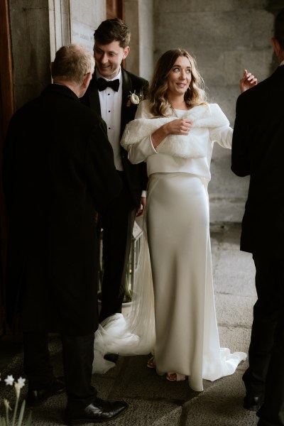 bride and groom outside wedding venue ceremony smiling