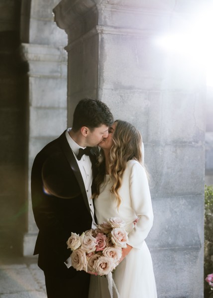 bride and groom kiss