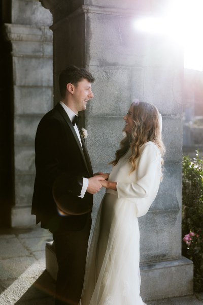 bride and groom joke around and laugh together