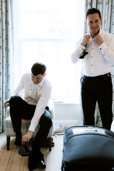 groom and groomsmen get ready together