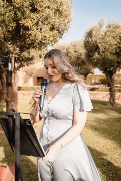 bridesmaid/woman gives speech during ceremony