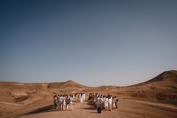 skyline view of desert and guests walking