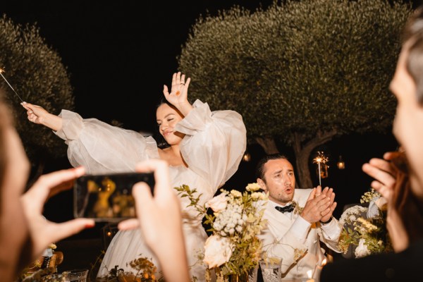 bride and groom dancing on the dancefloor groom clapping