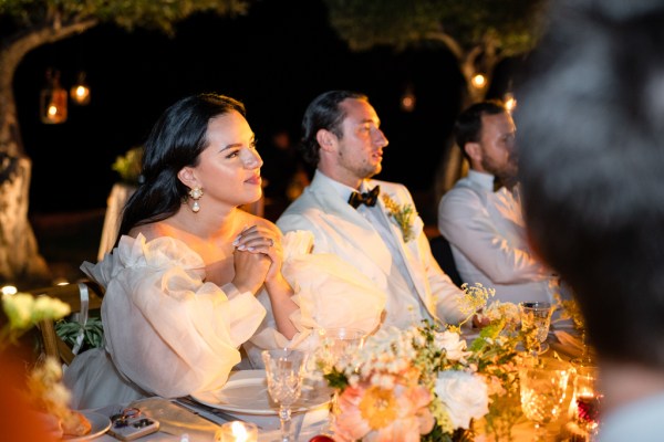 bride and groom sit at the dining room table together