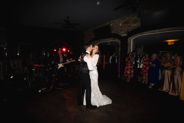 dark shot of bride and groom dancing on the dancefloor