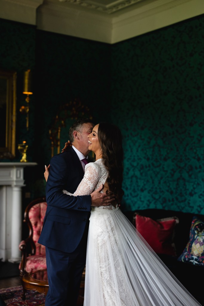 father of the bride hugs daughter emotional moment