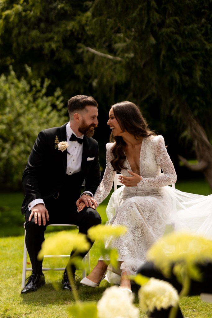 bride and groom are reunited at the alter they hold hands