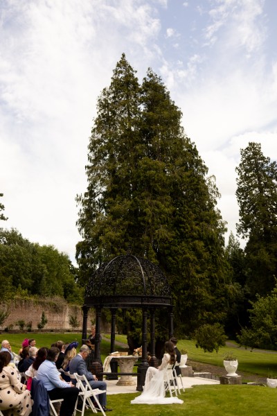 long view of ceremony bride and groom sitting at top