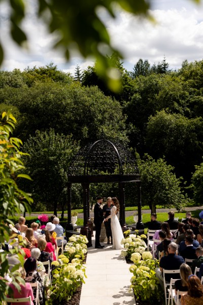 bride reads her vows to groom and audience