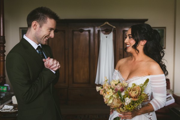 brother and sister smiling man in room