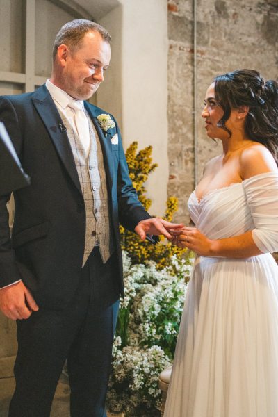 bride and groom at the alter