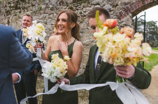 bridesmaids woman guest smiles during ceremony