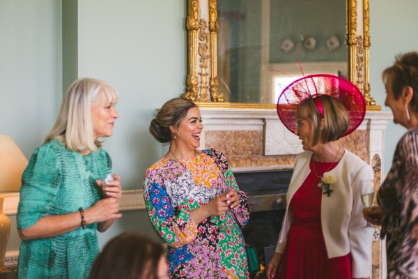 guests chatting drinking