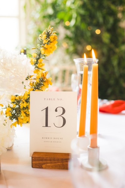 table 13 setting orange candles lit