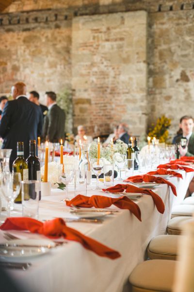 dining room ballroom table decor red serviettes and guests