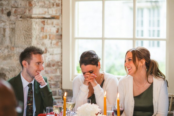 emotional woman at table laughing