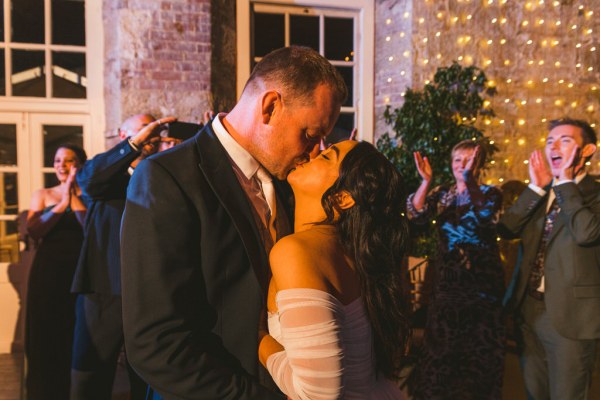 bride and groom kissing on the dancefloor