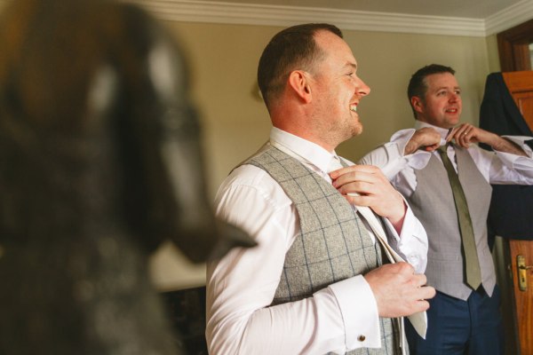 groom getting ready with groomsmen