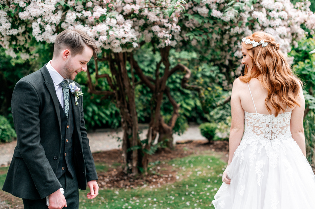 groom reacts to seeing brides dress