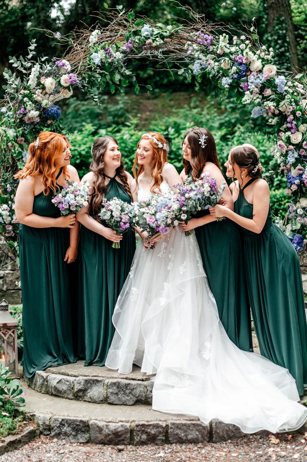 front view of bride in the middle of her bridesmaids