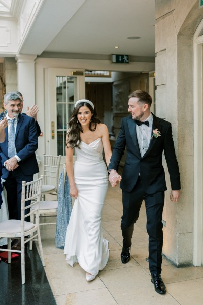 Bride and groom enter reception