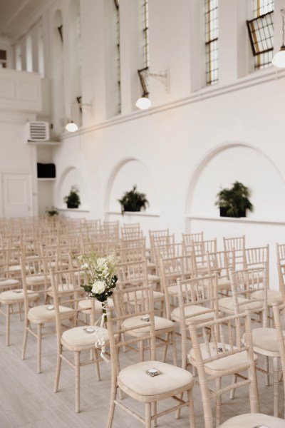 interior wide shot of ceremony white roses bouquet chapel church