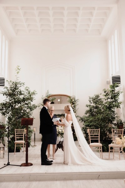 bride and groom at the alter together