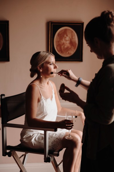 bride gets he makeup done by MUA