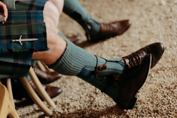 grooms shoes and green socks