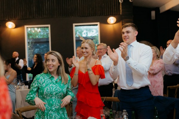 guests clapping for the happy couple