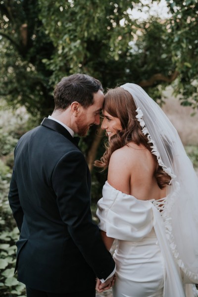 bride and groom touch foreheads