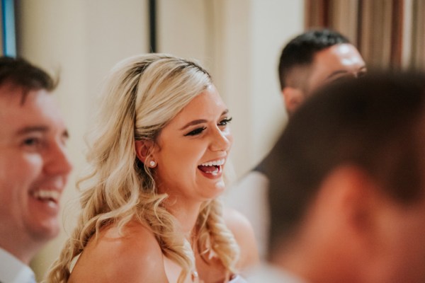 blonde bride smiles laughs