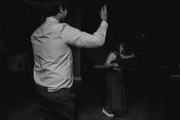 black and white shot of groom on the dancefloor