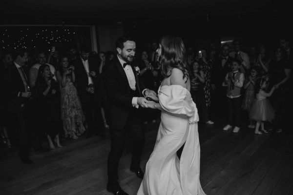 bride and groom dancing on the dancefloor black and white shot