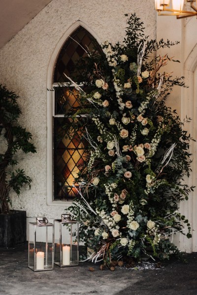 wreath flowers lanterns and candles lit