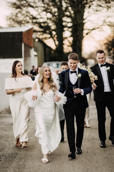 bride groom groomsman bridesmaid walk in forest setting