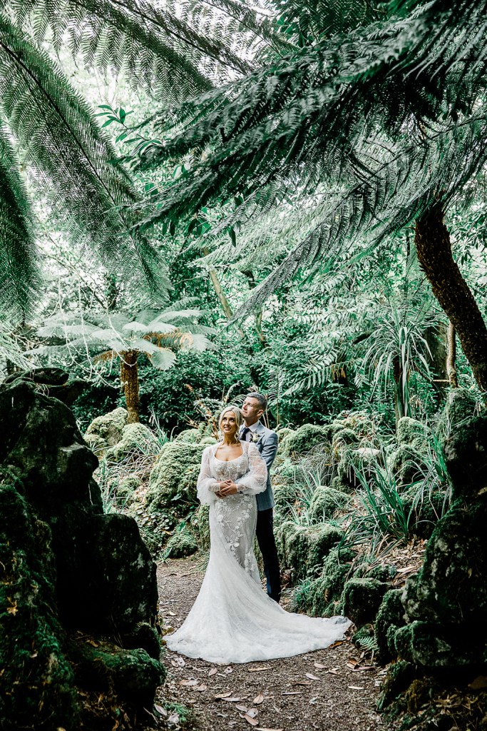 bride and groom hug embrace greenhouse interior