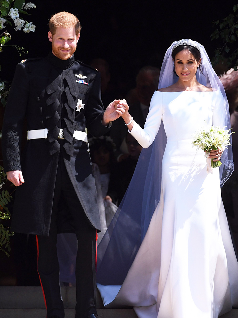 Mandatory Credit: Photo by Pool/ABACA/Shutterstock (13355188o)
Britain's Prince Harry and Meghan Markle kiss as they exit St George's Chapel in Windsor Castle after their royal wedding ceremony, in Windsor, Britain, 19 May 2018. The couple have been bestowed the royal titles of Duke and Duchess of Sussex on them by the British monarch.
Prince Harry and Meghan Markle  kiss as they exit St George's Chapel - Windsor, United Kingdom - 19 May 2018 | Celebrity Wedding Perfumes