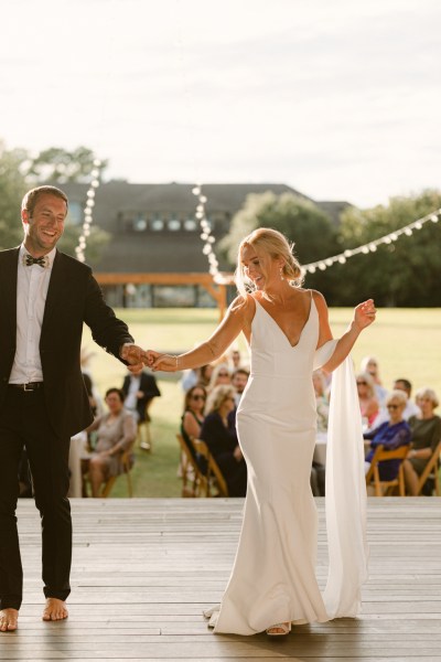 Bride and groom dance during wedding which oozed coastal Cali charm