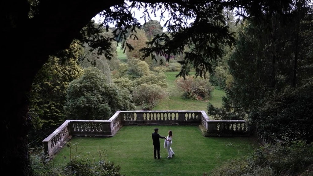 Bride and groom walk around Drenagh Estate Irish Country House wedding