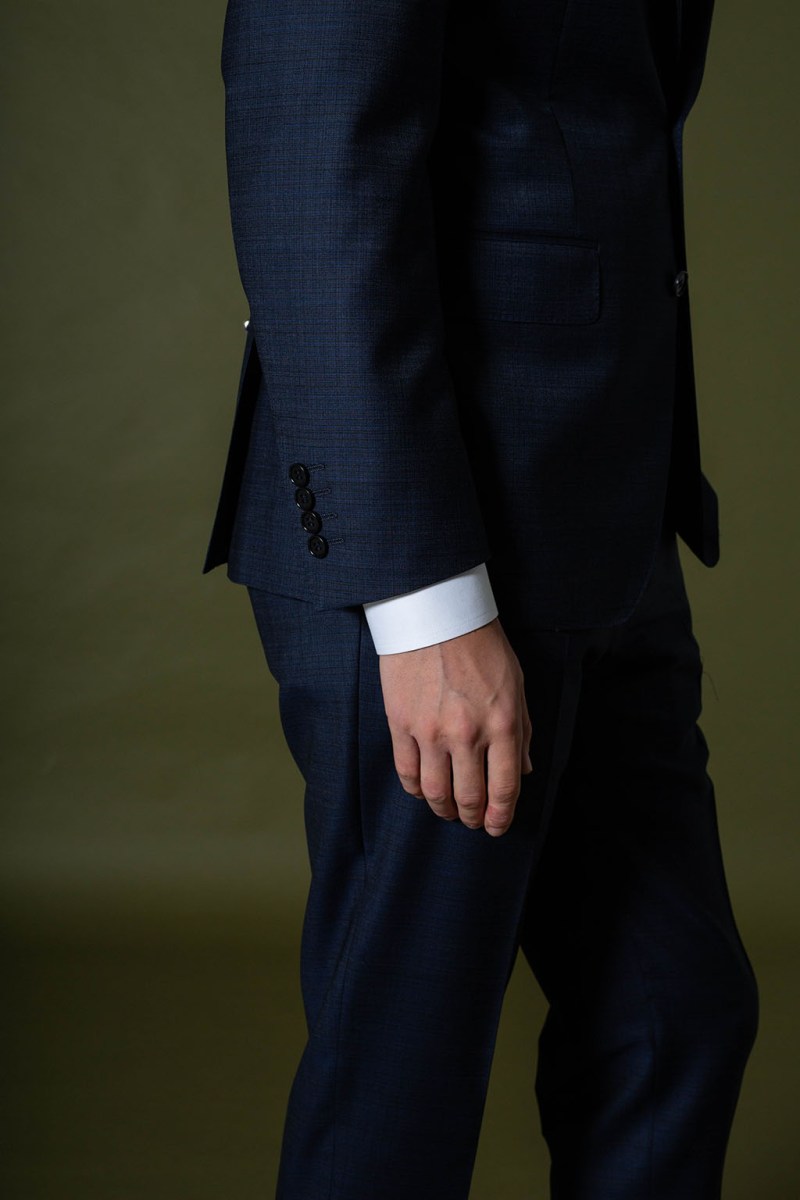 Male model wearing Louis Copeland & Sons wedding suit