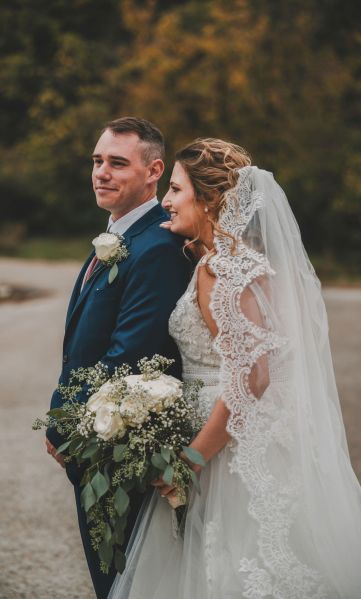 Bride and groom by a lake in real wedding Saturday Selection roundup